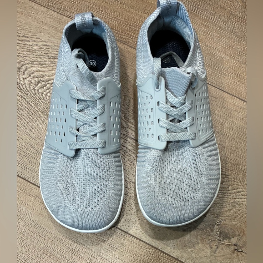 Whitin gray minimalist running shoes knit upper sock-like fit and a wide toe box